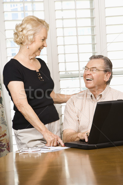 Mature couple with laptop. Stock photo © iofoto