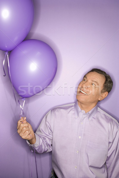 Hombre globos sonriendo caucásico púrpura Foto stock © iofoto