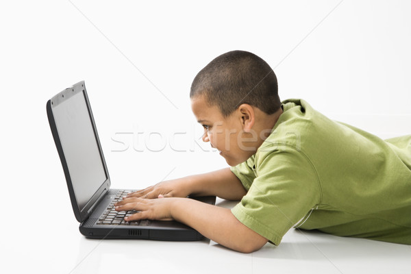 Hispanique garçon ordinateur jeunes utilisant un ordinateur portable enfant [[stock_photo]] © iofoto