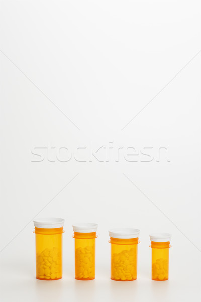 Stock photo: Yellow Medicine Bottles With Pills. Isoated