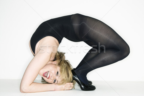 Woman doing backbend. Stock photo © iofoto