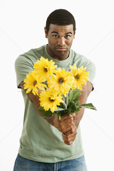 Pouting man with bouquet. Stock photo © iofoto