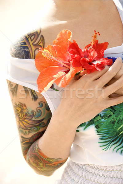 Kobieta wytatuowany hibiscus kwiaty Zdjęcia stock © iofoto