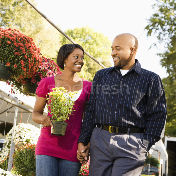 Smiling couple shopping. Stock photo © iofoto