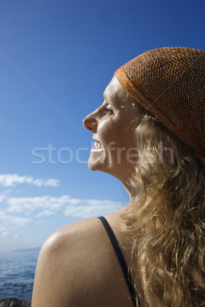 Happy woman at coast. Stock photo © iofoto