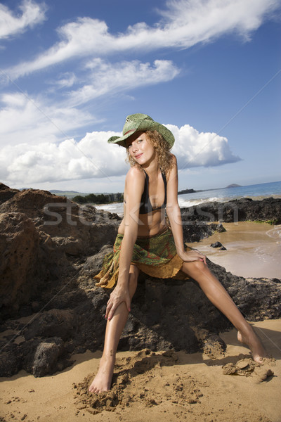 Portrait of young woman at beach. Stock photo © iofoto