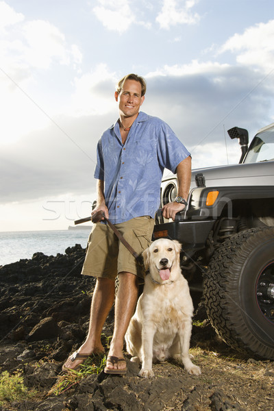 Man and Dog by SUV at the Beach Stock photo © iofoto