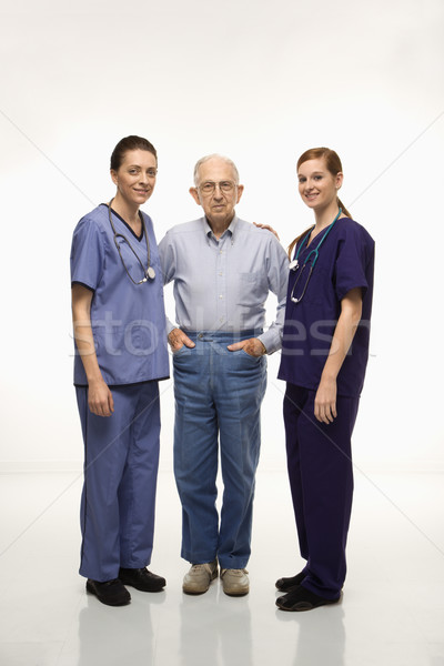 Man and medical workers. Stock photo © iofoto