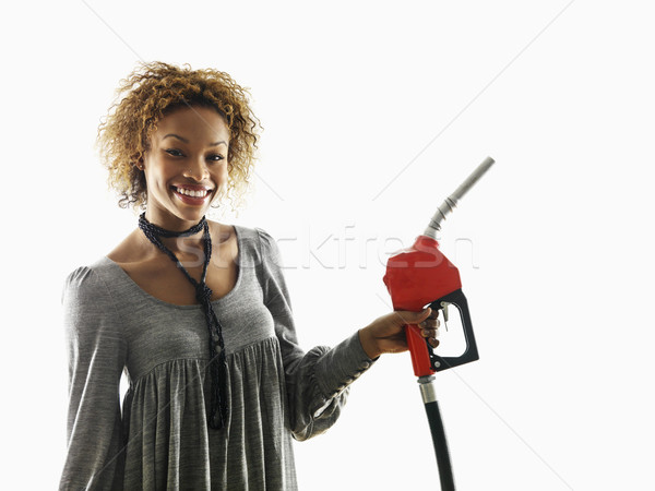 Woman holding fuel pump nozzle Stock photo © iofoto