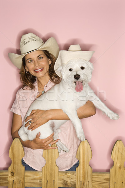 Woman and dog wearing cowboy hats. Stock photo © iofoto