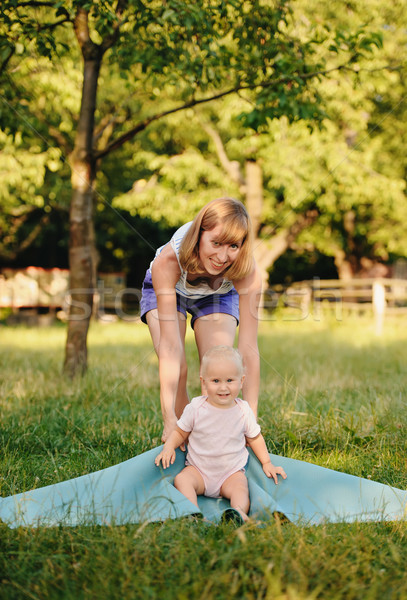 Mother and her daugther practice yoga Stock photo © Ionia