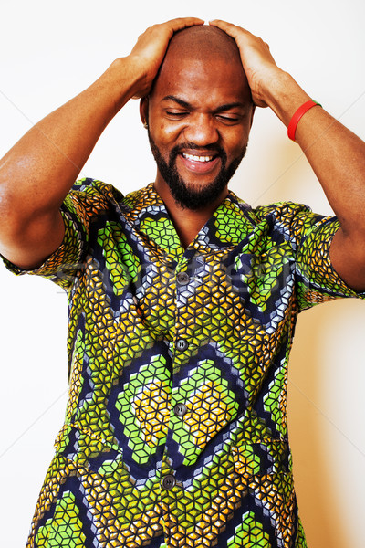 portrait of young handsome african man wearing bright green nati Stock photo © iordani