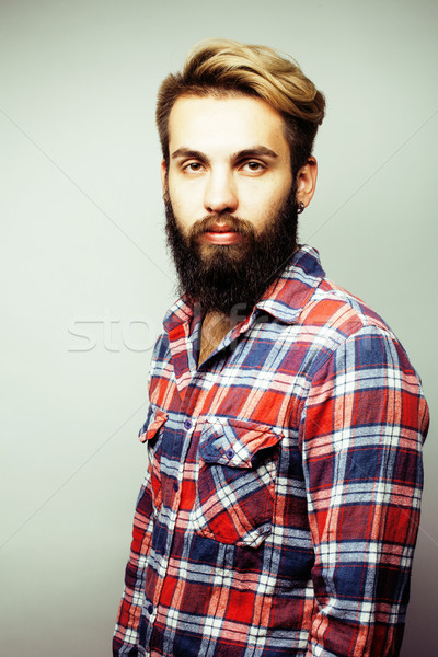 portrait of young bearded hipster guy smiling on white background close up, brutal man, lifestyle pe Stock photo © iordani