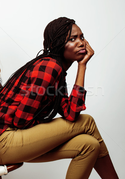 Stock photo: young pretty african-american girl posing cheerful emotional on white background isolated, lifestyle