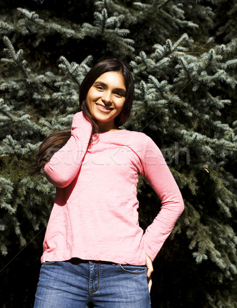 Stock photo: Enjoying the nature. Young woman enjoying the fresh air in green