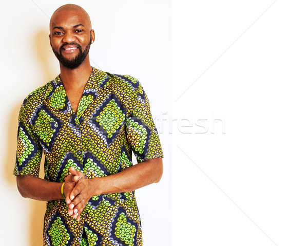 portrait of young handsome african man wearing bright green nati Stock photo © iordani