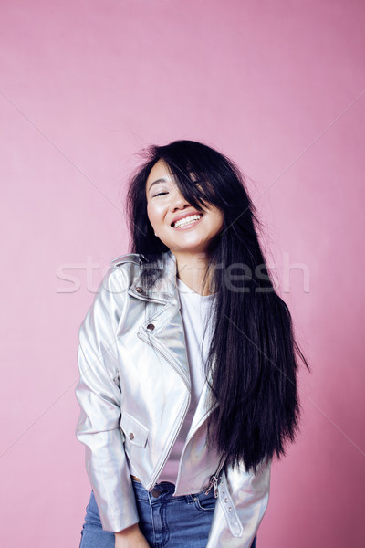 young pretty smiling asian korean girl wearing modern fashion clothers on pink background, lifestyle Stock photo © iordani
