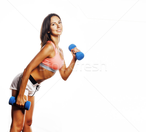 Stock photo: young pretty slim woman with dumbbell isolated