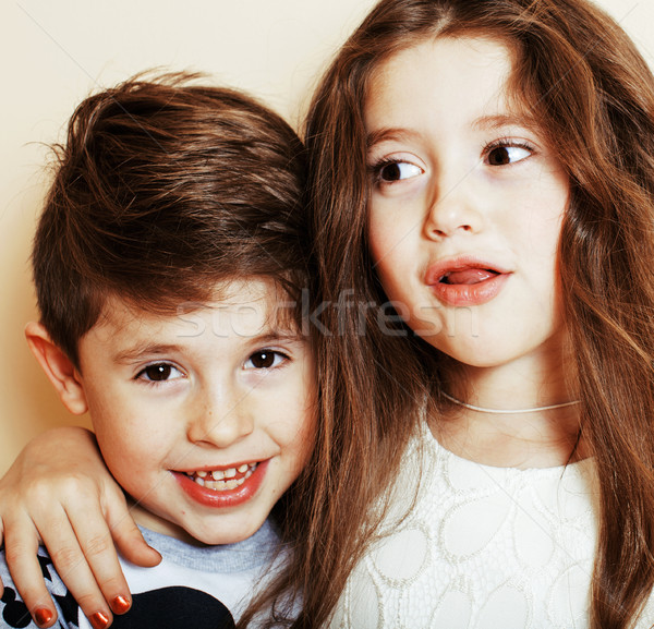 little cute boy and girl hugging playing on white background, ha Stock photo © iordani