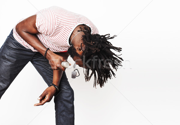 young handsome african american boy singing emotional with micro Stock photo © iordani