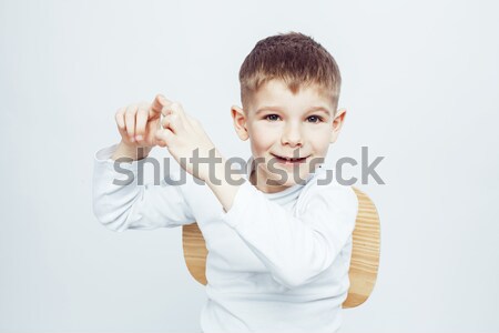 Stock photo: young pretty little cute boy kid wondering, posing emotional face isolated on white background, gest