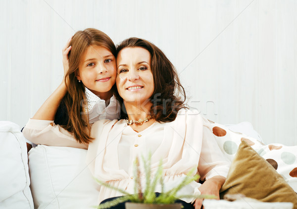 happy mother with daughter at home, real family Stock photo © iordani