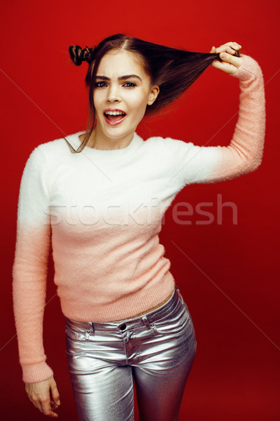 young pretty emitonal posing teenage girl on bright red background, happy smiling lifestyle people c Stock photo © iordani