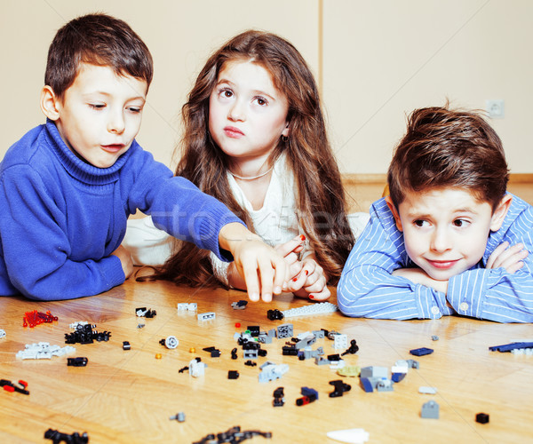 funny cute children playing toys at home, boys and girl smiling, first education role close up, life Stock photo © iordani