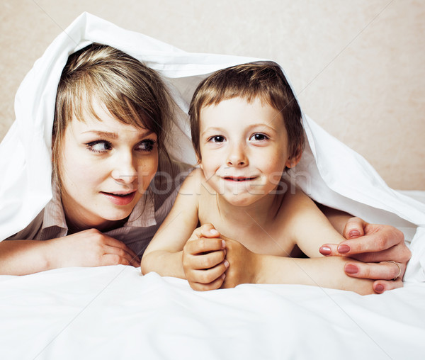 young blond woman with little boy in bed, mother and son, happy familyyoung blond woman with little  Stock photo © iordani
