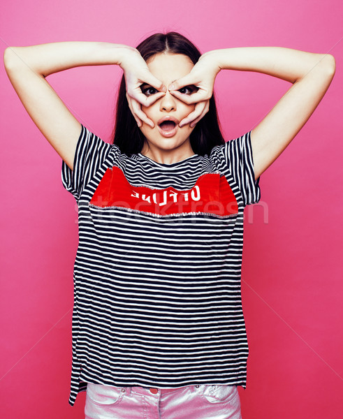 Stock photo: young pretty teenage woman emotional posing on pink background, fashion lifestyle people concept 