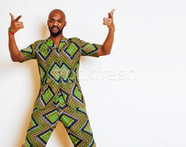 portrait of young handsome african man wearing bright green nati Stock photo © iordani