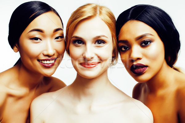 three different nation woman: asian, african-american, caucasian together isolated on white backgrou Stock photo © iordani