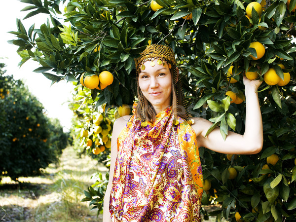 pretty islam woman in orange grove smiling, real muslim girl Stock photo © iordani