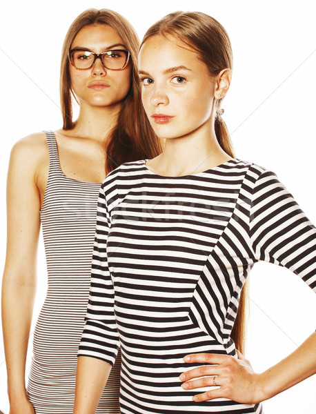 two young workers isolated on white, same dresses in strip Stock photo © iordani
