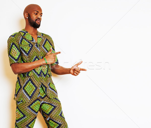 portrait of young handsome african man wearing bright green nati Stock photo © iordani