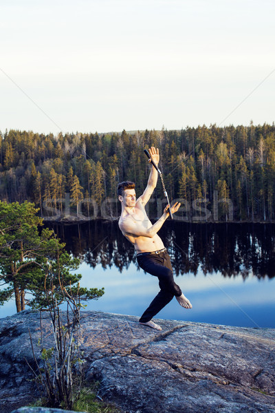 middle age man doing sport yoga on the top of the mountain, lifestyle people outdoor, summer wild na Stock photo © iordani
