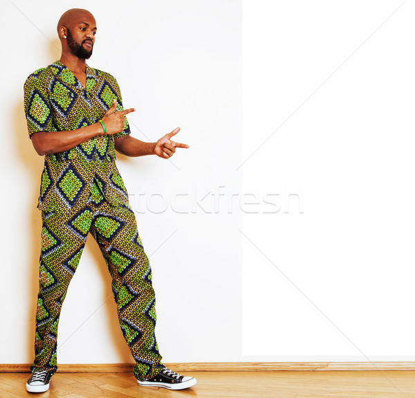 portrait of young handsome african man wearing bright green nati Stock photo © iordani