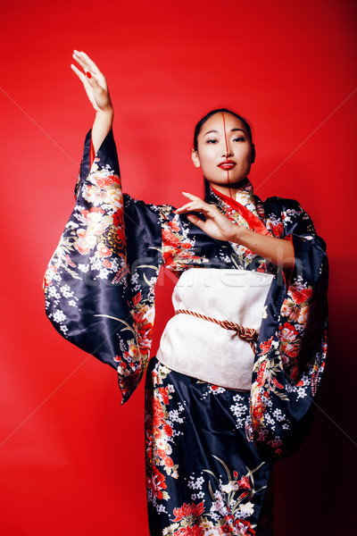 Jungen ziemlich Geisha rot posiert Kimono Stock foto © iordani