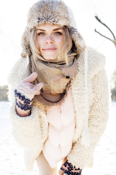 young pretty teenage hipster girl outdoor in winter snow park having fun drinking coffee, warming up Stock photo © iordani