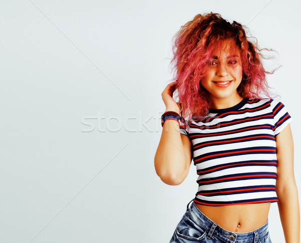 young cute mixed races girl teenage posing cheerfull on white background isolated, happy smiling lif Stock photo © iordani