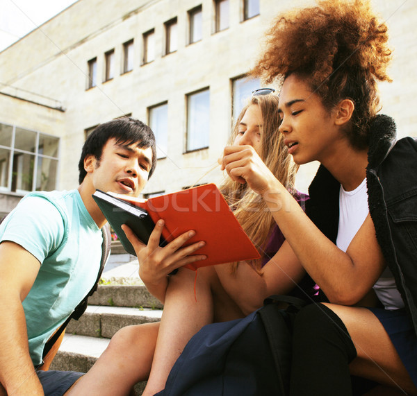 cute group teenages at the building of university Stock photo © iordani