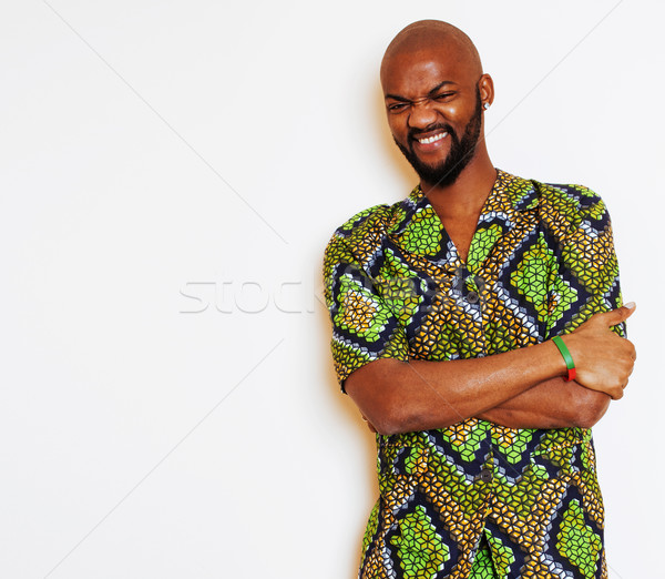 portrait of young handsome african man wearing bright green nati Stock photo © iordani