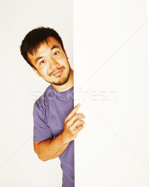 Stock photo: pretty cool asian man holding empty white plate smiling