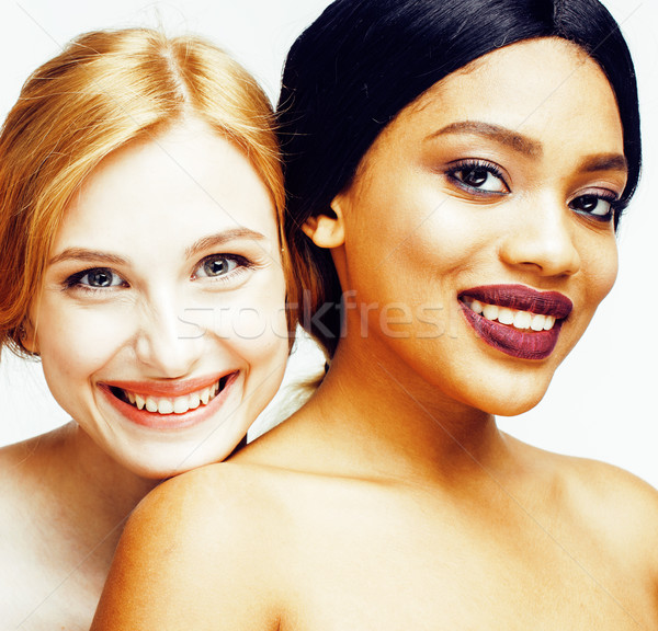 different nation woman: african-american, caucasian together isolated on white background happy smil Stock photo © iordani