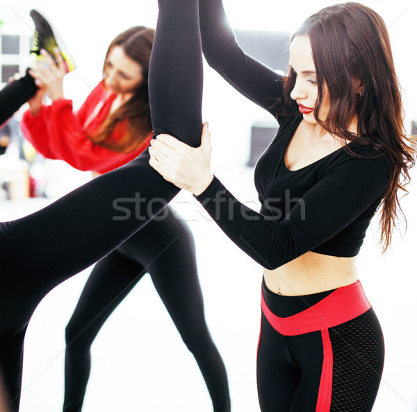 Women doing sport in gym, jumping, healthcare lifestyle people concept, modern loft studio Stock photo © iordani