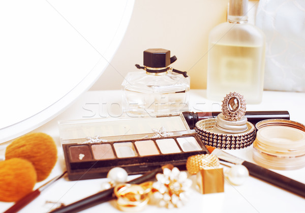 Jewelry table with lot of girl stuff on it, little mess in cosmetic brushes, interior concept Stock photo © iordani