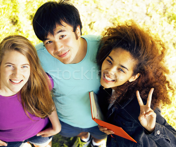 cute group of teenages at the building of university with books  Stock photo © iordani