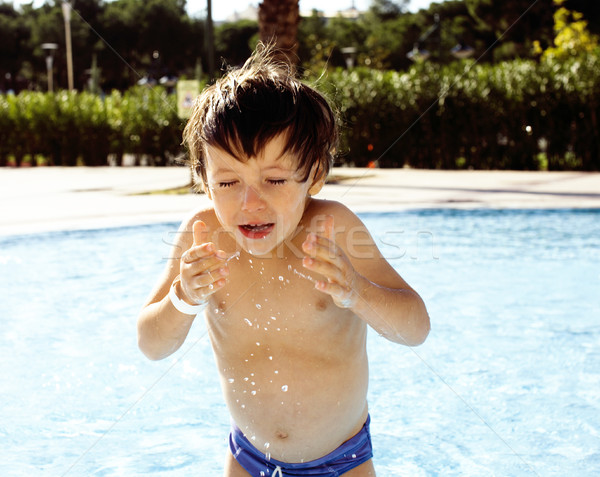 little cute real boy in swimming pool close up smiling Stock photo © iordani