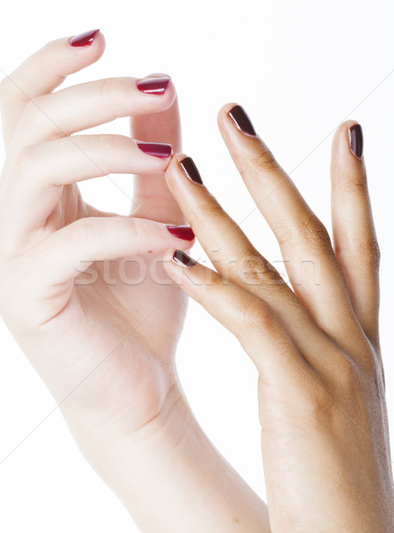 two different nathion manicured hands on white isolated, african with caucasian close up Stock photo © iordani