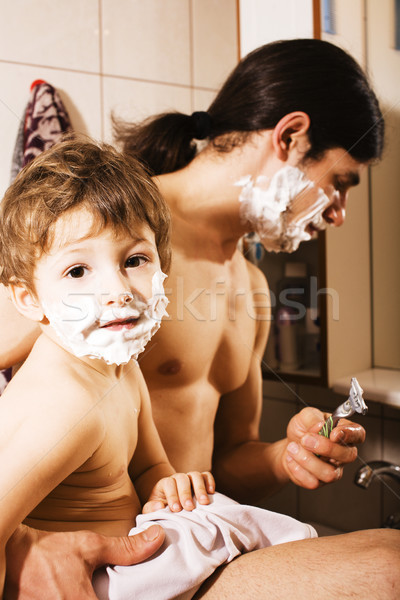 Stock photo: Portrait of son and father enjoying while shaving together, lifestyle people concept, happy family 